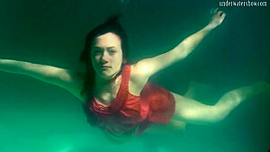 Red Dressed Mermaid Rusalka Swimming In The Pool